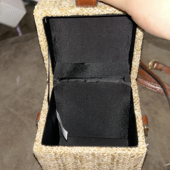 A purse that’s tan and brown with gold accents - Picture 2 of 5